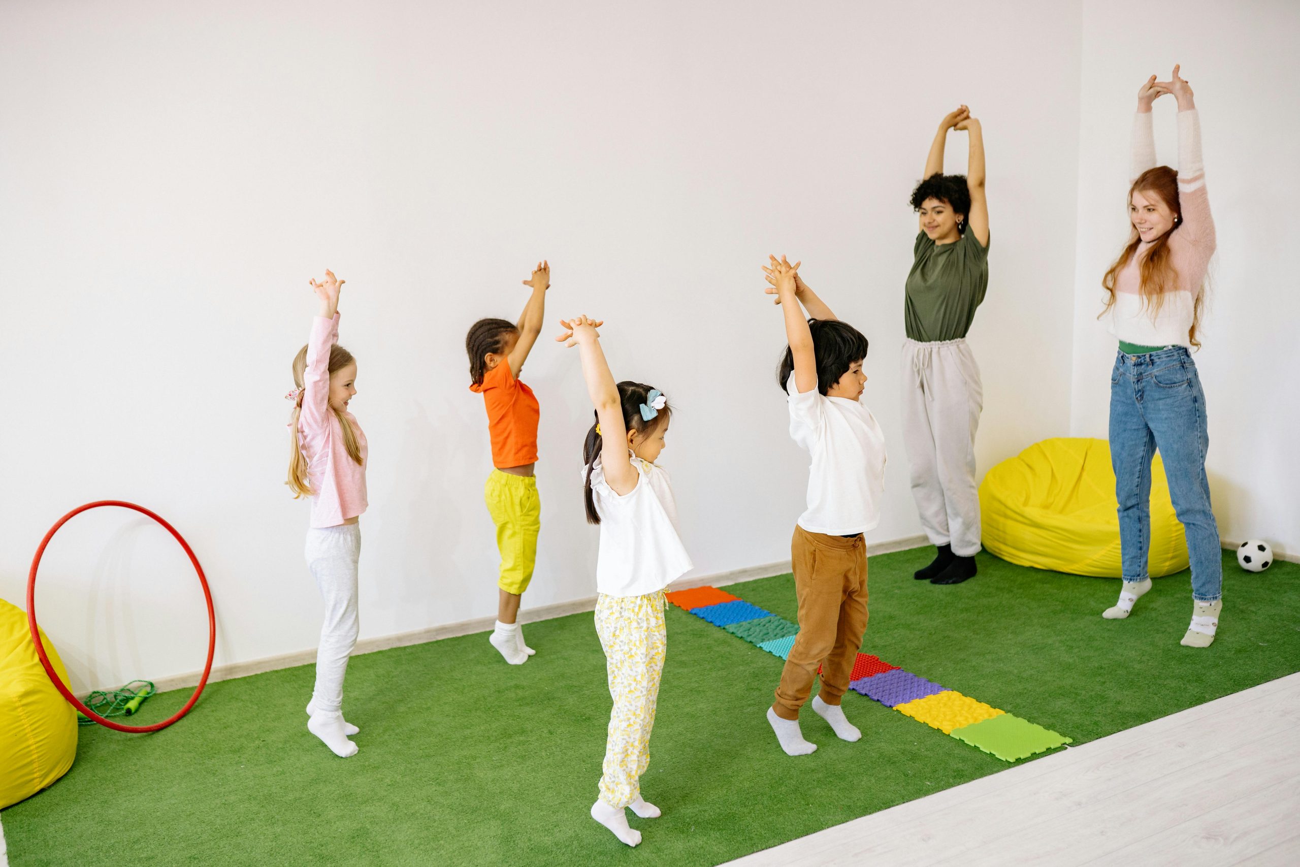 Children With Teachers Doing Stretching exercise